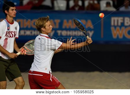 MOSCOW, RUSSIA - JULY 19, 2015: Daria Churakova (center) and Nikita Burmakin of Russia in the final match of Beach Tennis World Team Championship against Italy. Italy become world champion