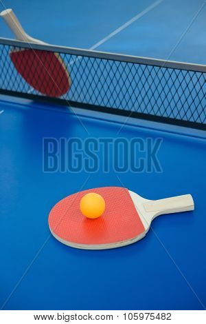 Pingpong Rackets And Ball On A Blue Pingpong Table