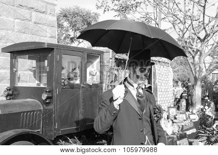 Man With Sugar Skull And Umbrella