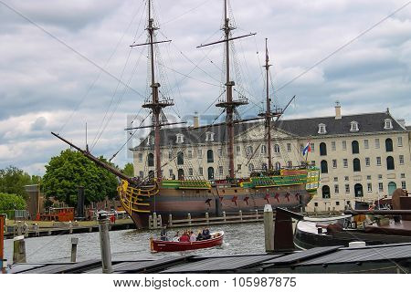 Tourists Visiting The Exhibits Of The Netherlands Maritime Museum In Amsterdam