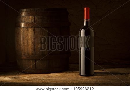 Still life with wine bottles, glasses and oak barrels  vintage