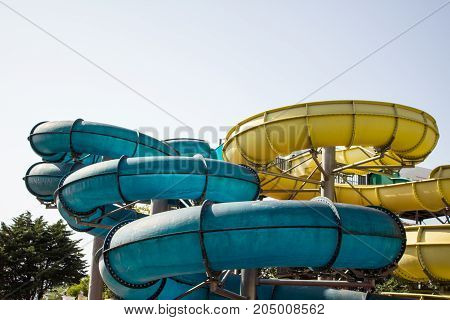Colourful Plastic Slides In Aquapark In The Sunlight