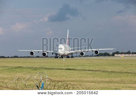 PRAGUE CZECH REPUBLIC - SEPTEMBER 20 2017: EMIRATES AIRLINES Airbus A380-800 rolls on the runway before departure from Prague. Emirates is an airline of the United Arab Emirates based in Dubai.