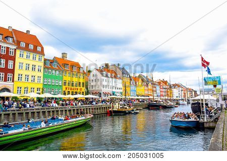 COPENHAGEN, DENMARK - JULY 20: Nyhavn, 17th century waterfront, canal and entertainment district and the popular tourist destination in Copenhagen, Denmark