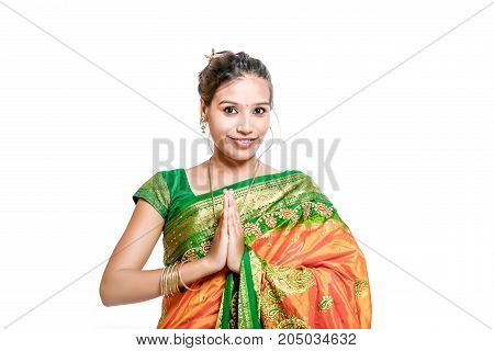 Happy young beautiful traditional Indian woman in traditional saree