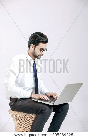 young indian businessman   with laptop