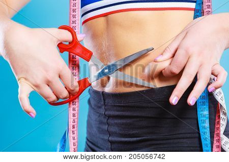 Woman Pinching Waist For Skin Fold Test