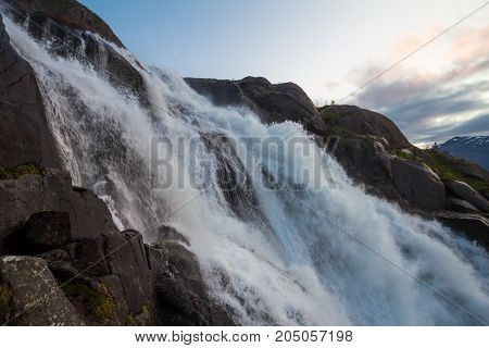 Summer Mountain Langfossen Waterfall On Slope Etne, Norway.