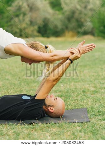 Sportt life and health concept. Yoga time on summer day.