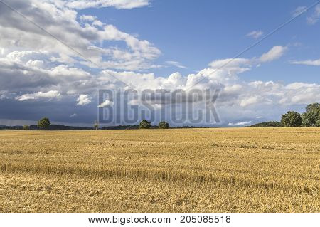 a clouded sky in rural agricultural ambiance