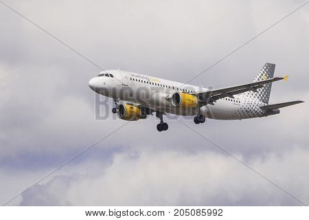 LONDON UK - AUGUST 6 2013; A Vueling Airbus A320 lands at Heathrow airport in London.