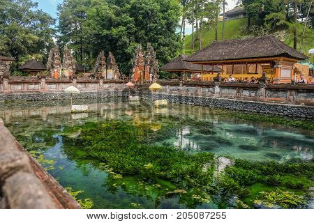 Bali Indonesia - September 92017: People visit Holy water spring in the Pura Tirta Empul Bali Indonesia