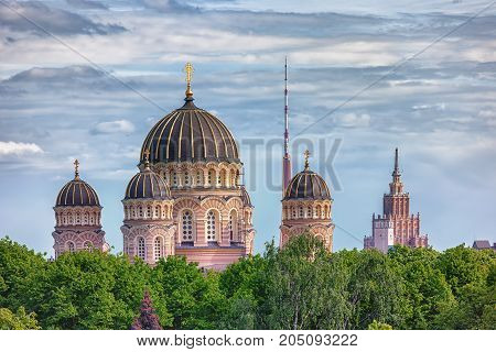 Cathedral in Riga next to the spire of the TV tower and the building of the Academy of Sciences of Latvia