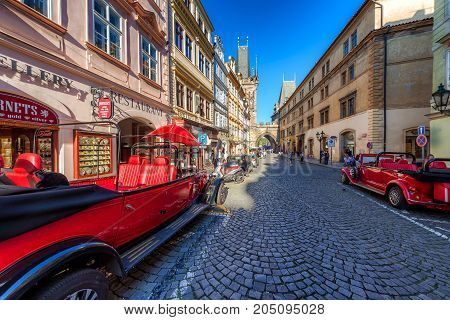 Prague Czech Republic - May 18 2017: Retro-styled Sightseeing Tour Cars Mostecka Street Mala Strana 