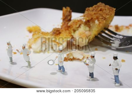 Tiny Of Cook Are Talking In The Kitchen.