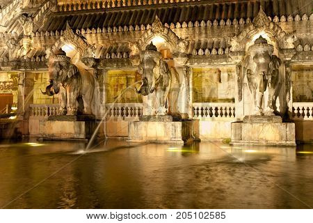 Decorative wall of cultural theme park on the island of Phuket, with elephant shape fountains. Phuket FantaSea park