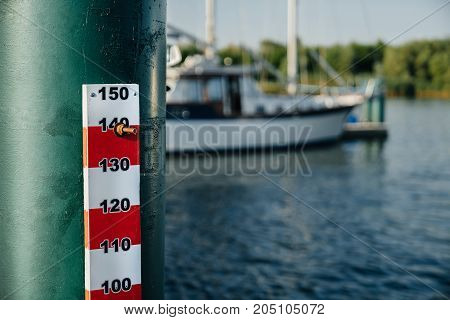 range of water level in the river on the background of the yacht.