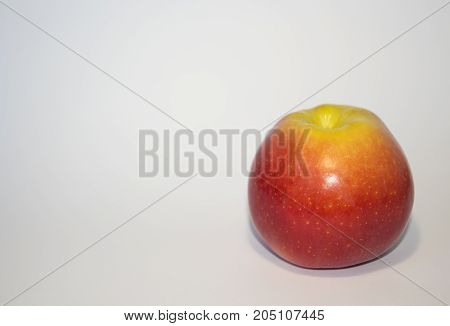 An Apple. Ripe fruit red apple isolated on white background. One apple on a white background.