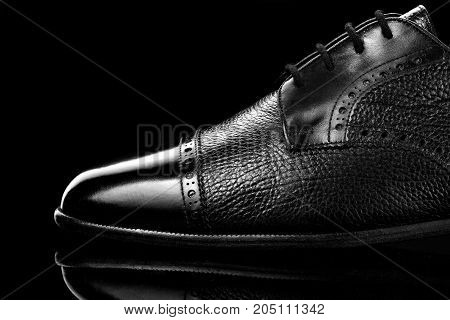 Black Oxford Polished Shoes On Black Miror Background.shoes Shine. Close Up.