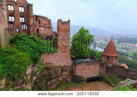 Ancient castle Wertheim. View from above of the ruined fortress walls and the old city in the fog. Germany. Tourist attraction