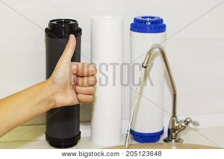 Great filters to purify your drinking water an image isolated in the kitchen interior.