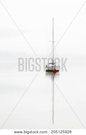 Single boat in a misty day in Alava