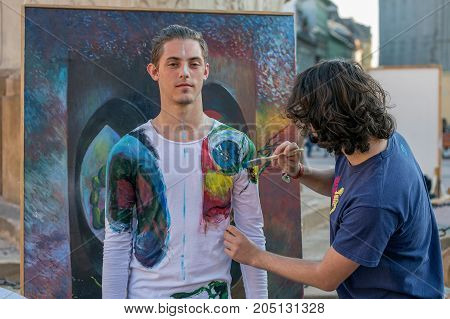 TIMISOARA ROMANIA - MARCH 31 2017: Face and body painting of a man. 3D art symbolizing on live at the street inside the CheckART Carnival organized by the City Hall Timisoara. Liberty Square.