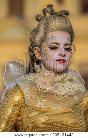 TIMISOARA ROMANIA - MARCH 31 2017: Living statue of a woman multicolor dressed and present on the street inside the CheckART Carnival organized by the City Hall Timisoara. Union Square.