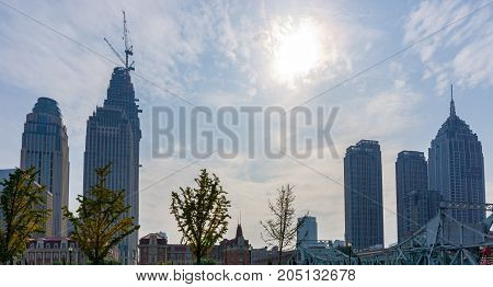 Tianjin, China - Nov 1, 2016: Commercial skyline across the Haihe River. Buildings in contrasting modern and old architectural style.
