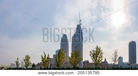 Tianjin, China - Nov 1, 2016: Commercial skyline across the Haihe River. Buildings in contrasting modern and old architectural style.