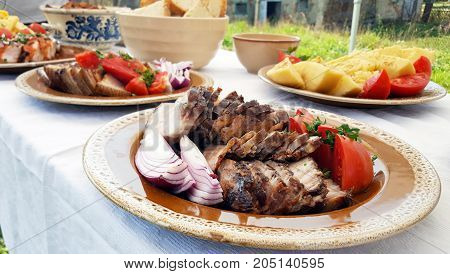 Traditional Romanian pork dish on a outdoor buffet
