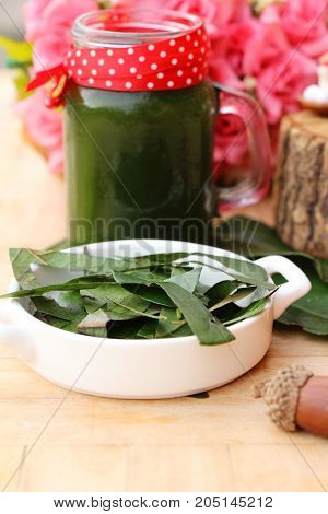 Bamboo grass juice or Tiliacora triandra (bai-ya-nang)