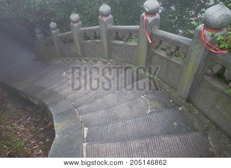 The Wudang MountainsHubei China. Many Taoist monasteries to be found thereIt's world heritate and famous in one of China. This here have a good weather somethime it a lot of the fog. Many stairs in there.