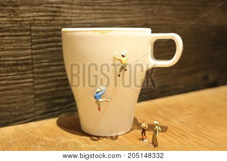 Fun Of Mini Tiny  People Climbing The Mug