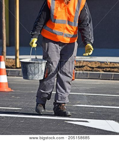 Worker at the road cosntruction in the city