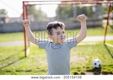 A Young caucassian soccer player football outside