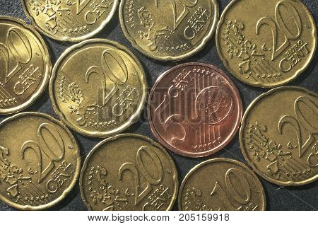 Various euro cent coins mosaic on a gray background