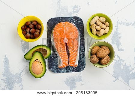 Assortment of food - sources of unsaturated fats and omega-3. Space for text