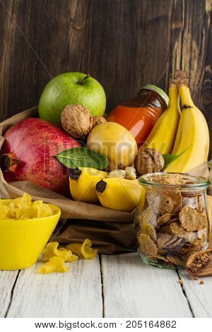 Products rich of complex carbohydrates. Healthy food on wooden background. Space for text