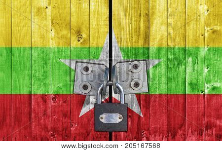 Myanmar flag on door with padlock close