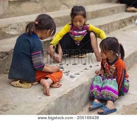 Children Play Game With Chalk And Rocks In North Vietnam