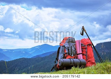 Backpacks in the mountains with views of the mountains.