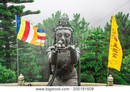 HONG KONG - MAY 31: Buddhist statue praising Tian Tan Buddha at Ngong Ping, Lantau Island, in Hong Kong