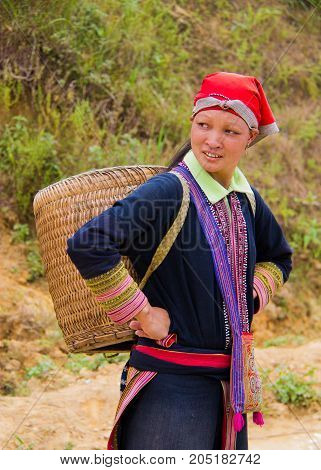 North Vietnamese Woman Carries Empty Basket On Her Back