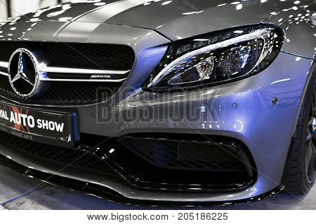 Sankt-Petersburg Russia July 21 2017: Front view of a Mercedes Benz C 63s AMG coupe 2017. Front Headlight. Dark Matt colour .Car exterior details. Photo Taken at Royal Auto Show July 21