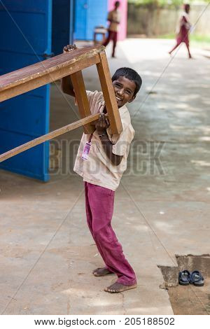 PONDICHERY PUDUCHERY INDIA - SEPTEMBER 04 2017. Unidentified child at schhol behind the window