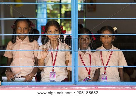 PONDICHERY PUDUCHERY INDIA - SEPTEMBER 04 2017. Unidentified child at schhol behind the window