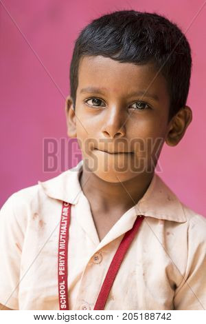 PONDICHERY PUDUCHERY INDIA - SEPTEMBER 04 2017. Unidentified child at schhol behind the window