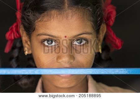PONDICHERY PUDUCHERY INDIA - SEPTEMBER 04 2017. Unidentified child at schhol behind the window