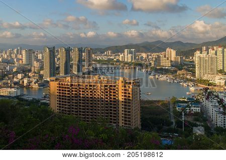 Sanya, China - April 07, 2017: Evening view of Sanya from the top of a hill in a Luhuitou Park